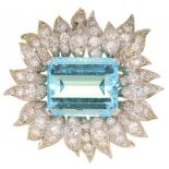 AN AQUAMARINE AND DIAMOND BROOCH the step cut aquamarine in pavé set flower shaped surround, 3.