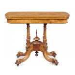 A VICTORIAN WALNUT AND INLAID CARD TABLE, C1870 with bow ended, quarter veneered top, 71cm h; 54 x