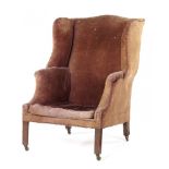 A GEORGE III MAHOGANY WING BACK ARMCHAIR, LATE 18TH C on chamfered square legs and brass castors ++