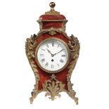 A FRENCH BRASS MOUNTED AND RED STAINED HORN MANTLE TIMEPIECE, C1900 with enamel dial, 43cm h++Dial