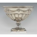 A GEORGE III SILVER PUNCH BOWL of hemispherical form applied with crisply chased festoons and oval