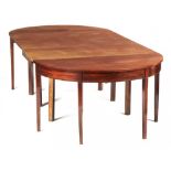 A GEORGE III MAHOGANY DINING TABLE, EARLY 19TH C with semi-circular ends and drop leaf centre