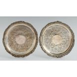 A PAIR OF GEORGE III SILVER WAITERS flat chased with a wide band of flowers and rocaille in