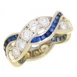 A SAPPHIRE AND DIAMOND TWIST RING with calibre cut sapphires, in platinum, 6.5g, size M½++Complete