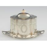 A VICTORIAN SILVER BISCUIT BOX of straight sided serpentine form with beaded rims and engraved