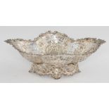 A VICTORIAN DIAPER PIERCED AND EMBOSSED SILVER FRUIT BOWL on openwork foot, 36.5cm l, by Mappin &