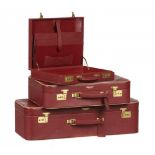 ASTON MARTIN. A SET OF RED LEATHER LUGGAGE TANNER KROLLE & CO LTD LONDON, C1990 comprising briefcase