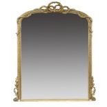A VICTORIAN GILTWOOD AND COMPOSITION OVERMANTLE MIRROR, C1870 the low arched frame crested by a