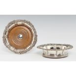 A PAIR OF VICTORIAN GADROONED SILVER WINE COASTERS the rim with shells and scrolling foliage at