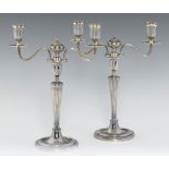 A PAIR OF GEORGE III NEO CLASSICAL SILVER CANDELABRA of two lights, the sconces, beaded nozzles