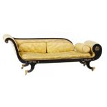 A GEORGE IV EBONISED COUCH with scroll back and end, retaining several gilt brass appliques, on