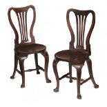 A PAIR OF GEORGE II MAHOGANY HALL CHAIRS, C1750 with spoon back and dished, almost round seat, on