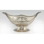 AN EDWARD VII PIERCED SILVER FRUIT BOWL of ogee form, chased with festoons and paterae, 15.5cm h, by