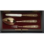 A GEORGE IV COMPOSED SILVER GILT CHRISTENING SET OF SPOON, FORK AND KNIFE with flower and shell