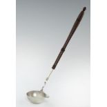 A GEORGE II SILVER PUNCH LADLE the underside of the bowl engraved with initials and date N*D 1755