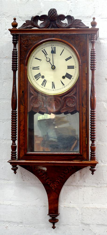 A CARVED AND INLAID WALNUT WALL CLOCK, 85 X 37CM