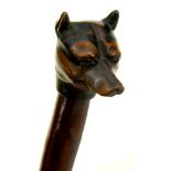 TREEN. A CARVED PAPER KNIFE WITH GLASS EYED DOG'S HEAD HANDLE, 33CM L