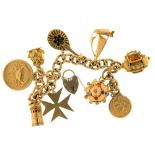 A 9CT GOLD CHARM BRACELET WITH NINE GOLD CHARMS, 104G++LIGHT WEAR CONSISTENT WITH AGE