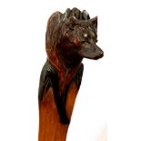 A CONTINENTAL CARVED AND STAINED WOOD PAPER KNIFE, THE HANDLE AS THE HEAD OF A FOX, 40.5CM L, C1900