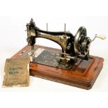 A FRISTER & ROSSMAN 1900S VIBRATING SUTTLE MACHINE, OPERATING MANUAL, BOX COVER AND KEY