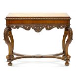 A CARVED WALNUT SIDE TABLE ON SCROLLING LEGS AND STRETCHER BASE WITH QUARTER VENEERED TOP, 85CM H;