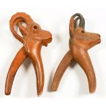 TWO SWISS ZOOMORPHIC CARVED LIMEWOOD GLASS EYED MOUNTAIN GOAT NUT CRACKS OF LEVER TYPE, 20 AND