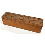 TREEN. A BOX OF NARROW RECTANGULAR FORM, THE LID CARVED WITH TWO BIRDS AND ACORNS, 37.5CM L, C1900