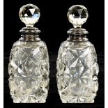 A PAIR OF GEORGE V SILVER RIMMED CUT GLASS SCENT BOTTLES WITH STOPPERS, 15.5 CM H, LONDON 1921++