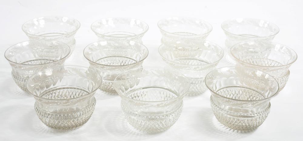 A SET OF ELEVEN CUT GLASS THISTLE SHAPED FINGER BOWLS, ENGRAVED WITH A BORDER OF THISTLES, 13CM D,