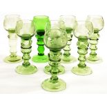 EIGHT GERMAN REVIVALIST ENGRAVED GREEN GLASS HOCKS, WITH RASPBERRY PRUNTS, DOMED FOOT, 18.5CM H,