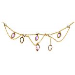 AN EDWARDIAN PEAR SHAPED AMETHYST AND PEARL FESTOON NEKLACE, IN GOLD MARKED 15C, 5G++IN GOOD