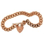 A 9CT GOLD CURB LINK BRACELET WITH HEART SHAPED CLASP, LONDON 1996, 29G++LIGHT WEAR CONSISTENT