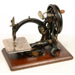 A WILCOX & GIBBS 1880/90S SERIAL 591890 HAND CRANKED SEWING MACHINE