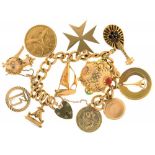 A 9CT GOLD CHARM BRACELET WITH ELEVEN GOLD CHARMS, 105G++LIGHT WEAR CONSISTENT WITH AGE