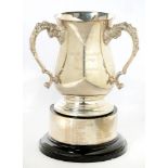 AN EPNS THREE HANDLED TROPHY CUP AND STAND, 23 CM H INCLUDING STAND, INSCRIBED MPBGE LADIES THE F.H.