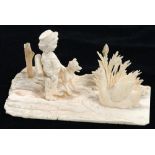 A MINIATURE CARVED IVORY GROUP OF A YOUNG SCHOLAR AND HIS DOG STANDING BEFORE A SWAN, 10.5CM L, LATE