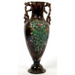 A NORTHERN EUROPEAN ART POTTERY ROPE HANDLED VASE OF ATTENUATED SHIELD SHAPE, APPLIED WITH