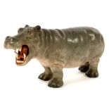 A GERMAN PORCELAIN MODEL OF A RHINOCEROS, 9CM H, HOCHST, UNDERGLAZE BLUE WHEEL AND CROWN