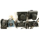 TWO ZENIT 35MM CAMERAS ONE OLYMPICS COMMEMORATIVE 1980 AND TWO EARLIER ROLL FILM CAMERAS