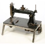 A BRUNONIA 1880S SEWING MACHINE, LATER STAND TO ENABLE SIGHT OF VIEW MECHANISM,