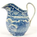 A STAFFORDSHIRE BLUE PRINTED EARTHENWARE JUG WITH VILLAGE CHURCH AND THATCHED COTTAGE, 20CM H,