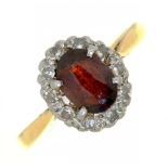 A GARNET AND DIAMOND CLUSTER RING IN GOLD MARKED 18CT, 3G, SIZE K++WEAR CONSISTENT WITH AGE