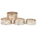 A PAIR OF GEORGE V SILVER NAPKIN RINGS, BIRMINGHAM 1929 AND TWO OTHER SILVER NAPKIN RINGS, 2OZS 1DWT
