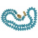 AN ITALIAN NECKLACE OF TURQUOISE BEADS oval gold clasp, 50cm l, marked 750, 50g++Good condition`