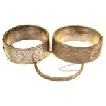 THREE ENGRAVED SILVER BANGLES, BIRMINGHAM 1939, CHESTER 1951, AND BIRMINGHAM 1950, 94G++DAMAGE AND