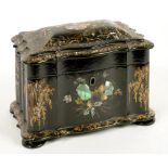 A VICTORIAN PAPIER MACHE TEA CADDY, INLAID IN MOTHER OF PEARL AND DECORATED WITH GILT FOLIAGE THE