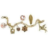 A 9CT GOLD BRACELET WITH SEVEN GOLD CHARMS, THREE OF 9CT GOLD, ANOTHER MARKED 375 AND THREE