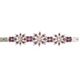 A RUBY AND DIAMOND BRACELET, OF FLORAL DESIGN, IN 18CT WHITE GOLD, 23G++IN GOOD CONDITION