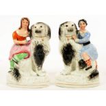 A PAIR OF STAFFORDSHIRE EARTHENWARE FIGURES OF A BOY OR GIRL ON A MASTIFF, 17CM H, C1860