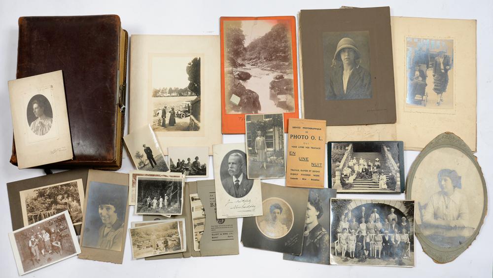 A VICTORIAN LEATHER PHOTOGRAPH ALBUM CONTAINING CARTES DE VISITE AND OTHER PORTRAITS AND A SMALL